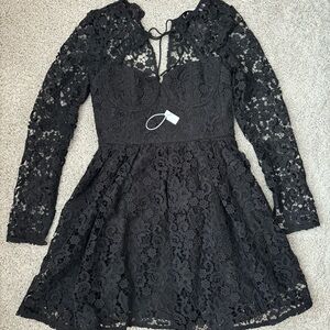 Similar to Self Portrait black lace tie-neck dress long sleeve. US 6